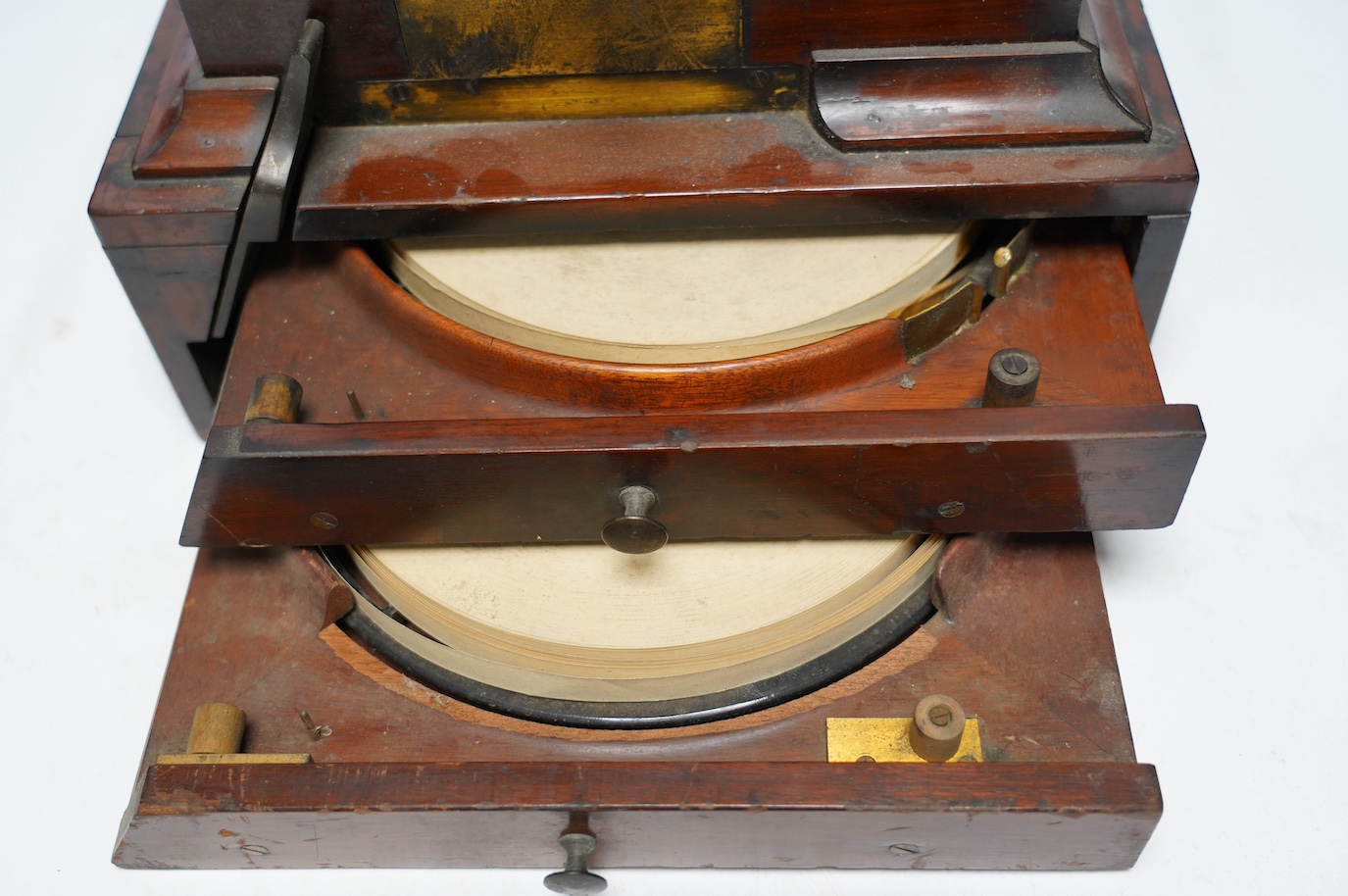 A late 19th century brass and mahogany Wheatstone type telegraph receiver (Morse inker), containing two drawers with paper rolls, 30cm high, 30cm wide, 28cm deep.